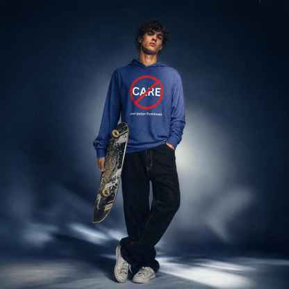Person wearing a blue hoodie t-shirt with a 'Don't Care' logo, holding a skateboard against a dark background