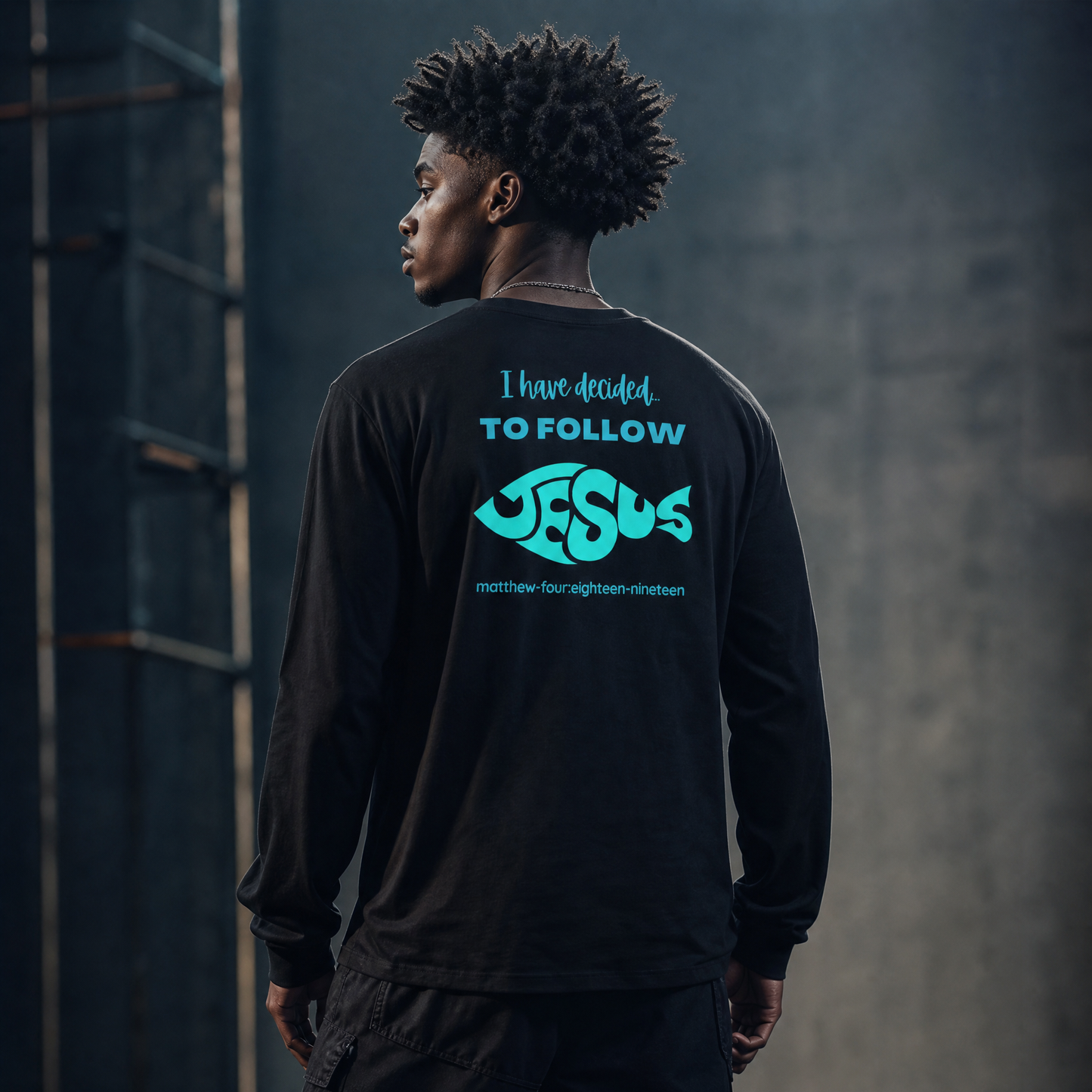 Model is wearing a black 'I have Decided To Follow Jesus' long sleeve t-shirt against a dark background