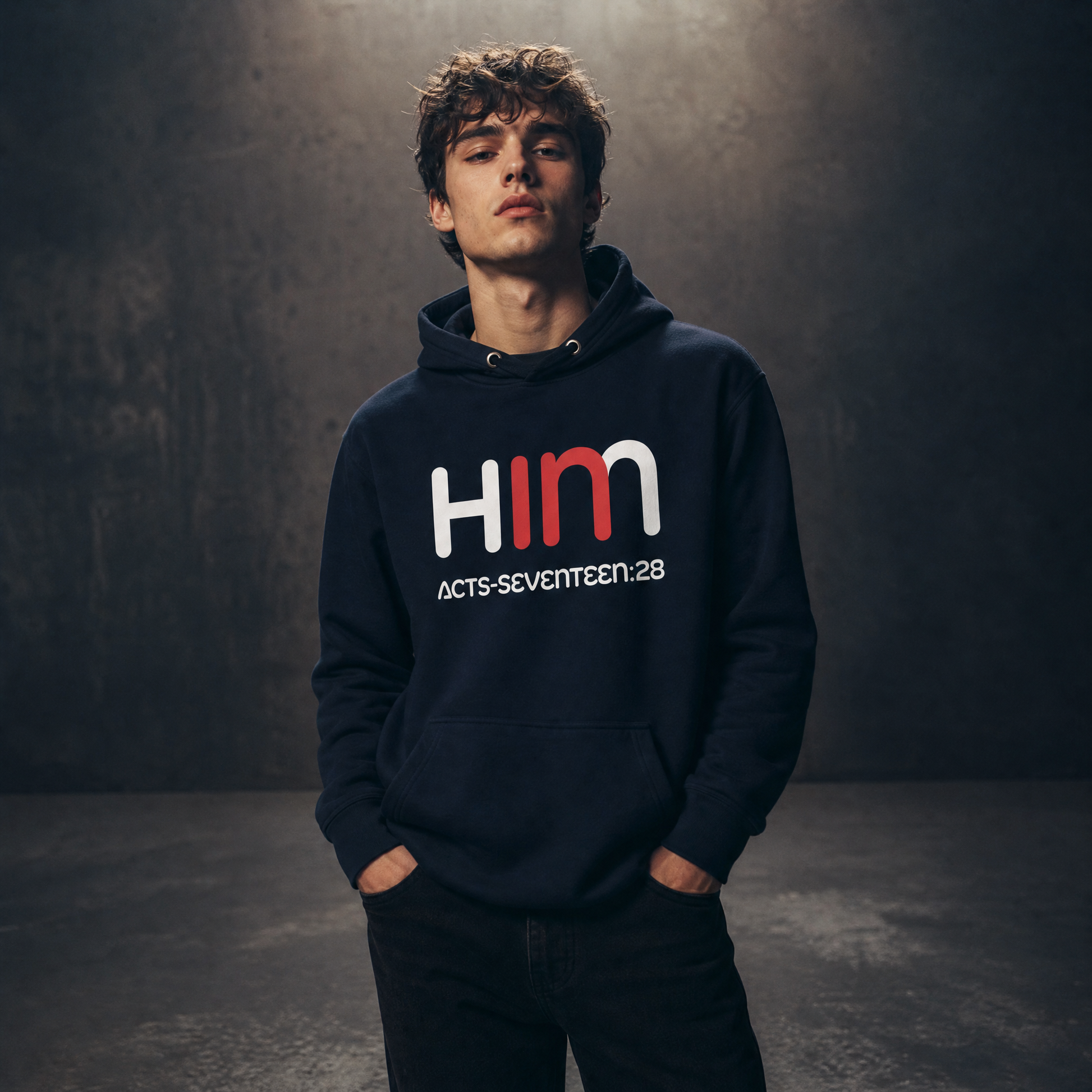 Person wearing a dark hoodie with 'IN HIM' text on a dark background