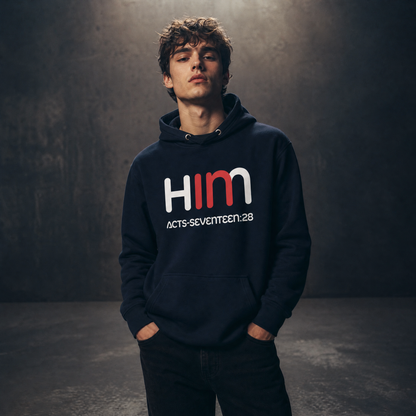 Person wearing a dark hoodie with 'IN HIM' text on a dark background