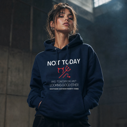 Person wearing a navy blue hoodie with text 'Not Today' with a symbol of a devil standing in a dimly lit room.
