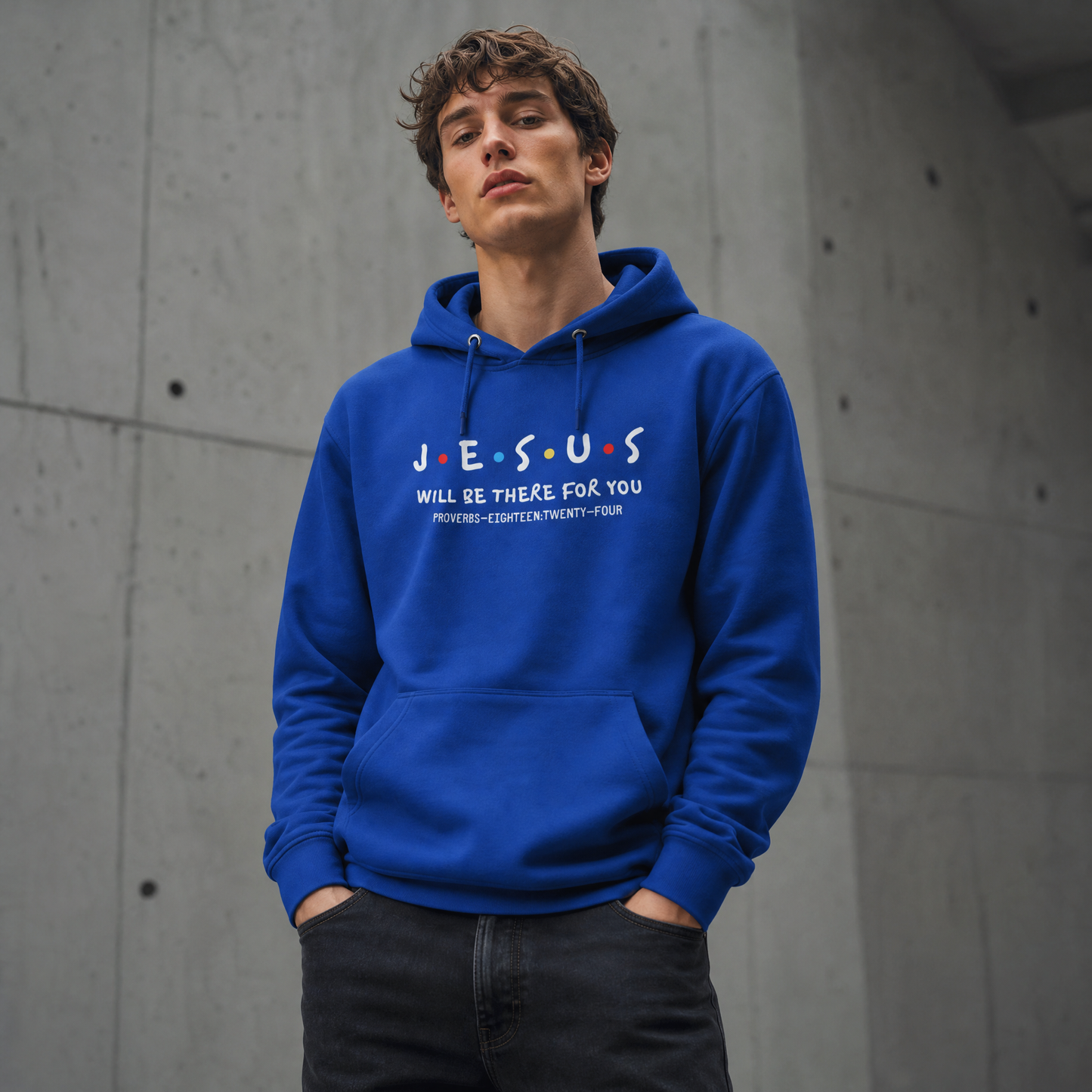 Person wearing royal blue hoodie with 'JESUS WILL BE THERE FOR YOU' text against a concrete wall background