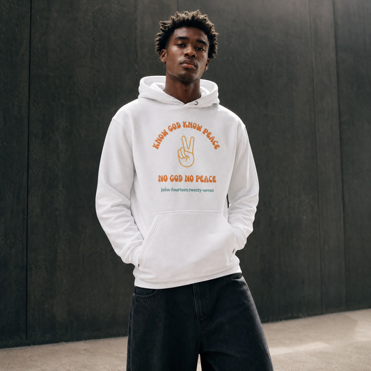 Person wearing a white hoodie with text 'Know God Know Peace, No God No Peace' with a peace symbol design standing against a dark background