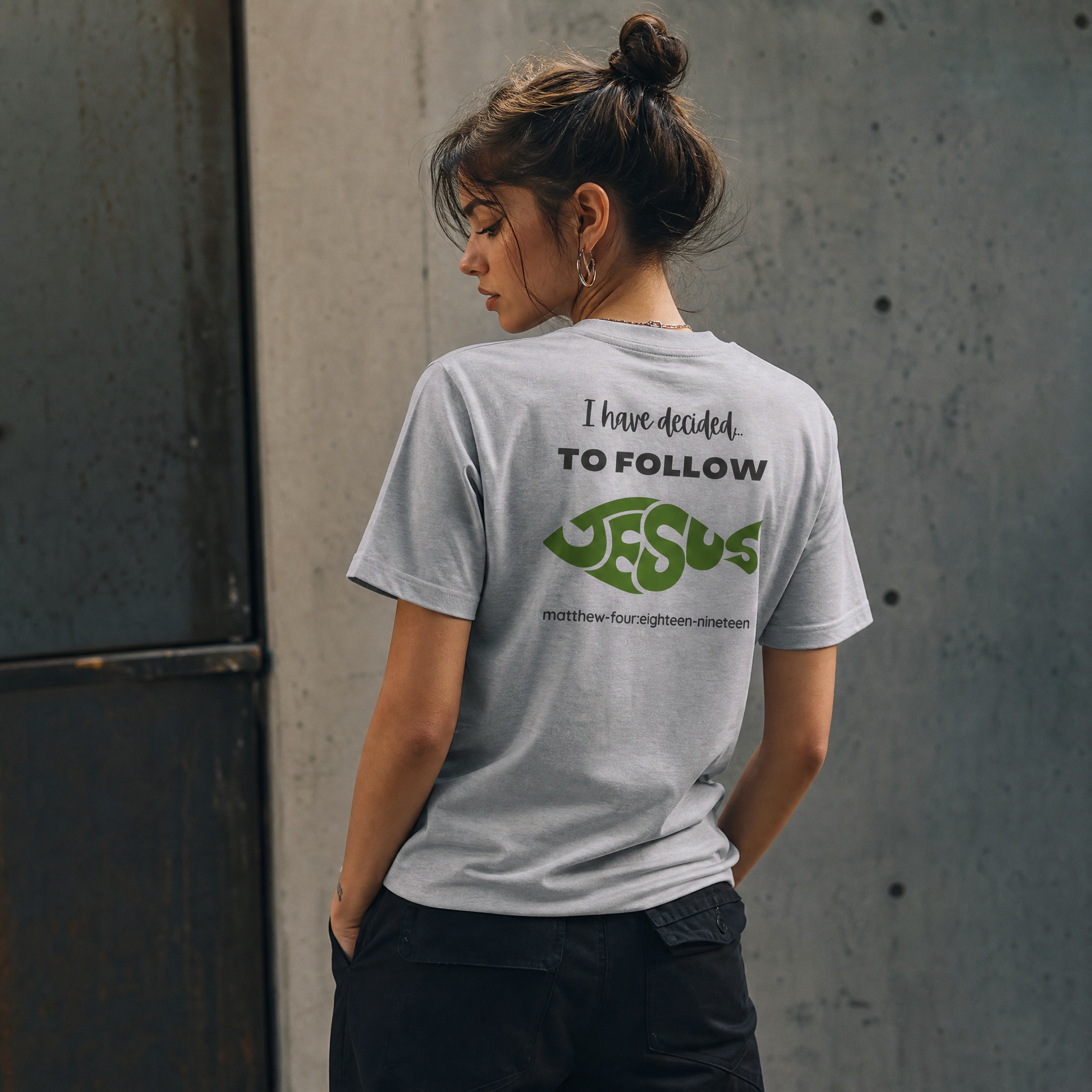 Person wearing a gray t-shirt with 'I have decided to follow Jesus' text.