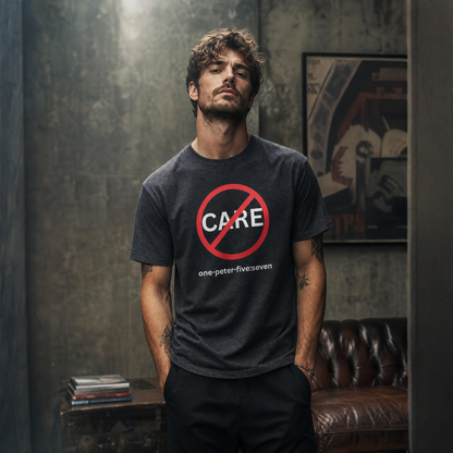 Man wearing a dark gray t-shirt with a "Don't Care" logo in a dimly lit room.