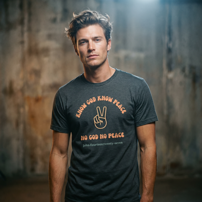 Man wearing a dark gray t-shirt with text 'Know God Know Peace, No God No Peace' with a peace symbol standing against a textured wall background
