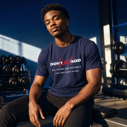 Person wearing a dark blue t-shirt with motivational quote 'Don't Limit God' in a gym setting