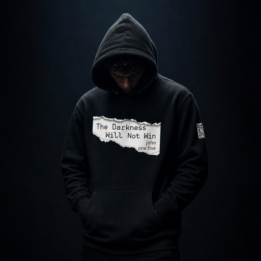 Person wearing a black hoodie with text The Darkness Will Not Win