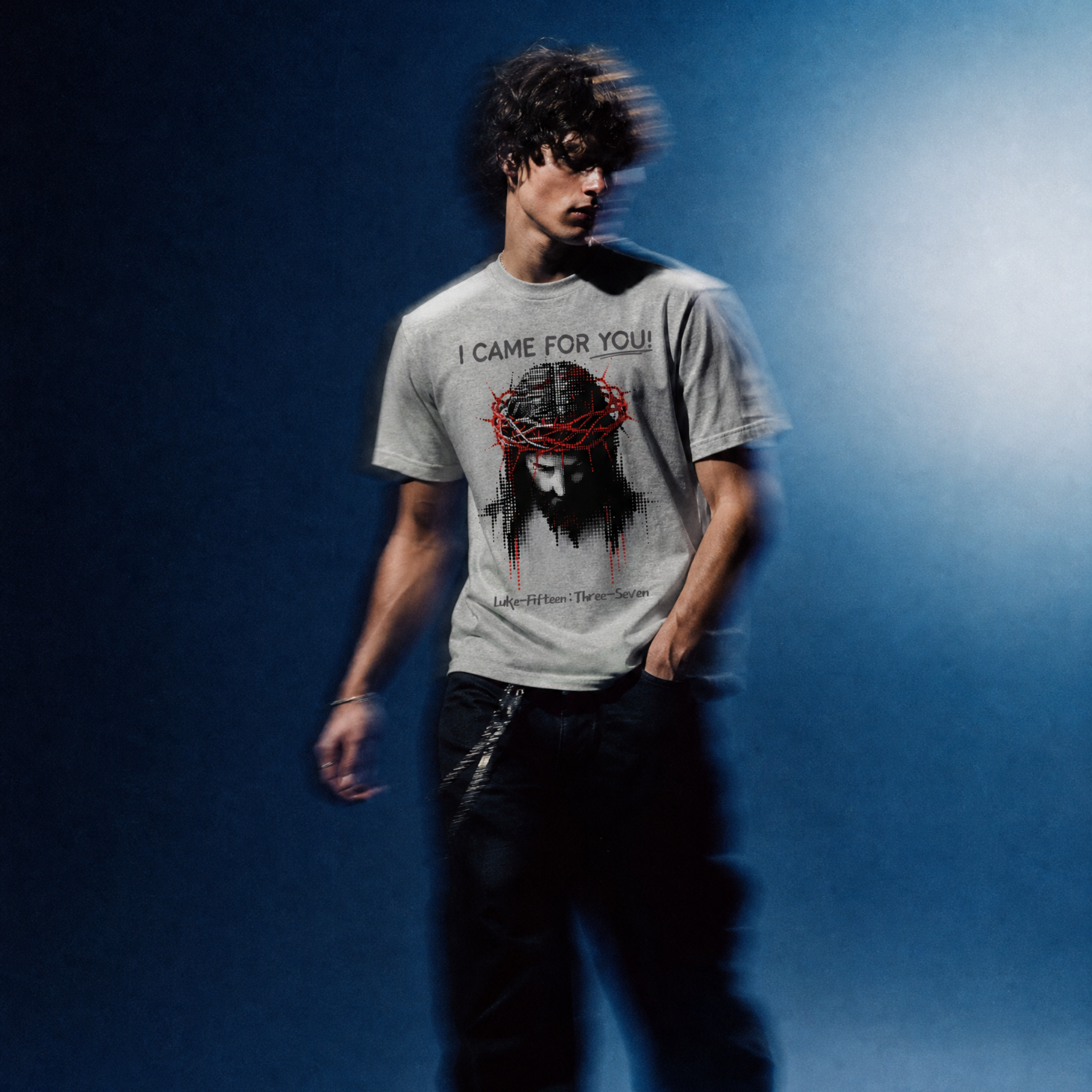 Person wearing a t-shirt with a graphic design and text against a blue gradient background