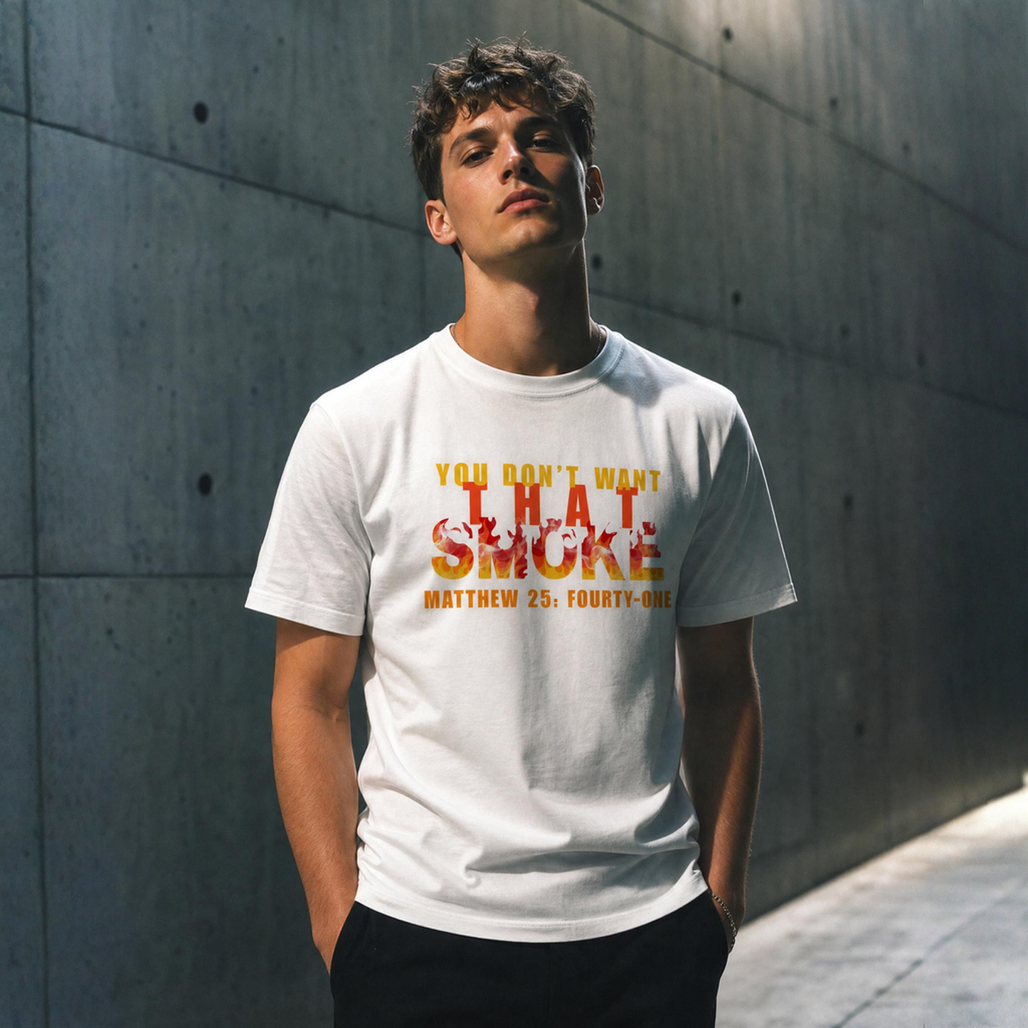 Person wearing a white t-shirt with text You Don't Want That Smoke against a concrete wall.